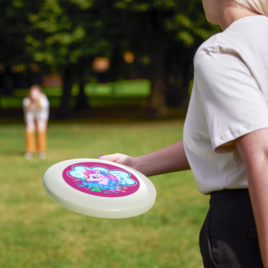 Black frisbee featuring a bold circular pattern with a playful pink unicorn at the center.