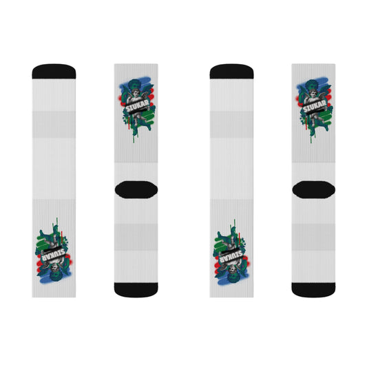 Socks with a powerful angel motif set against Roma flag hues, accented by ‘SZUKAR’ text on the side.