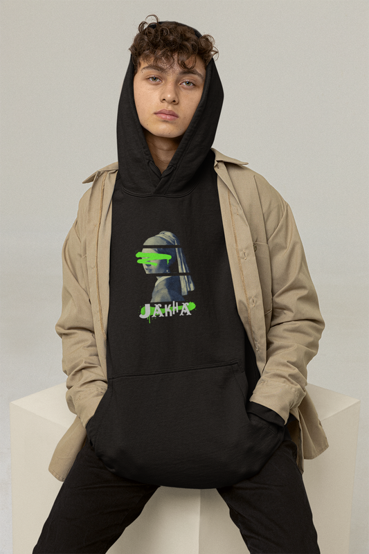 Person wearing a black hoodie with a graphic design, sitting on a white chair against a plain background