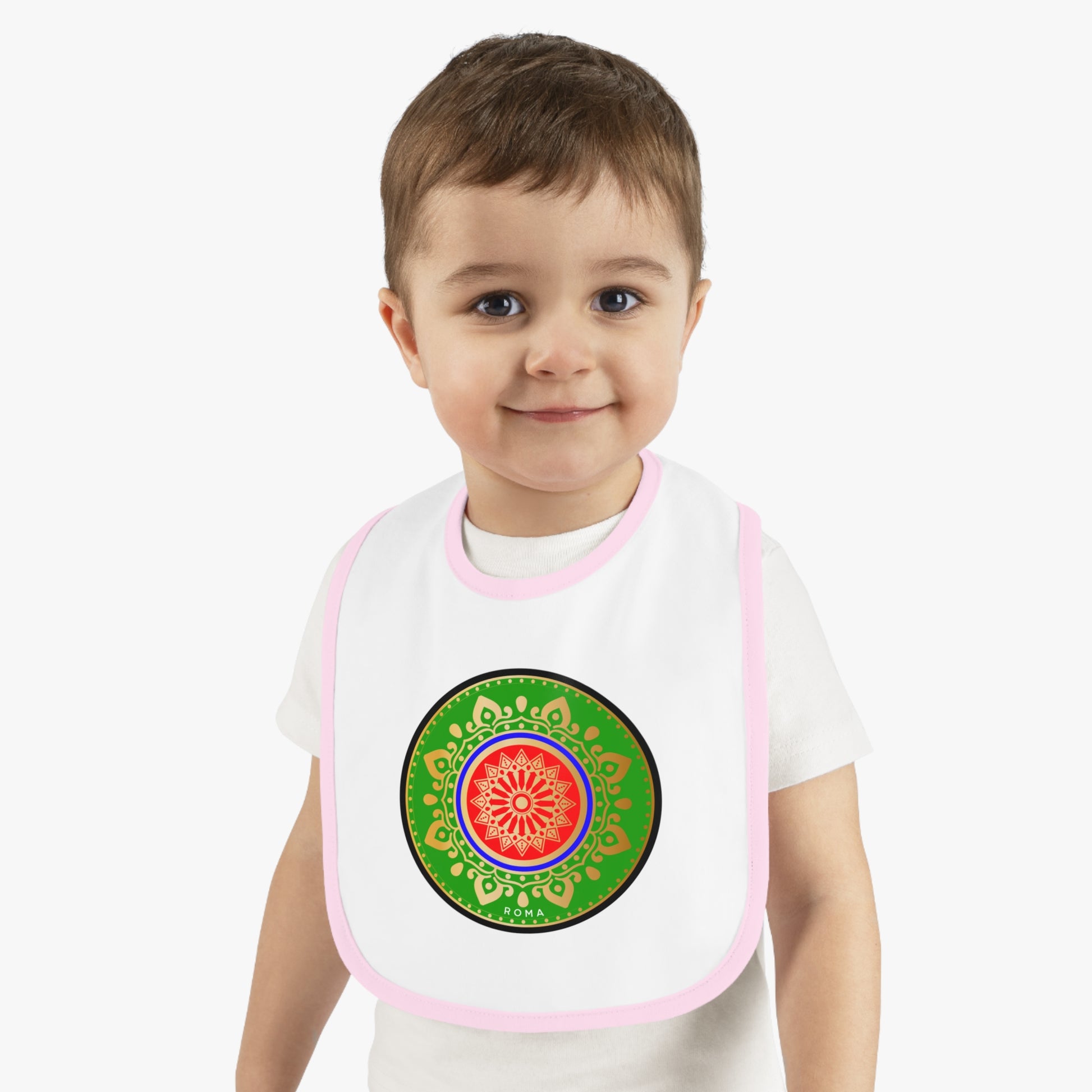 Joyful infant in a bib, grinning with pure delight.