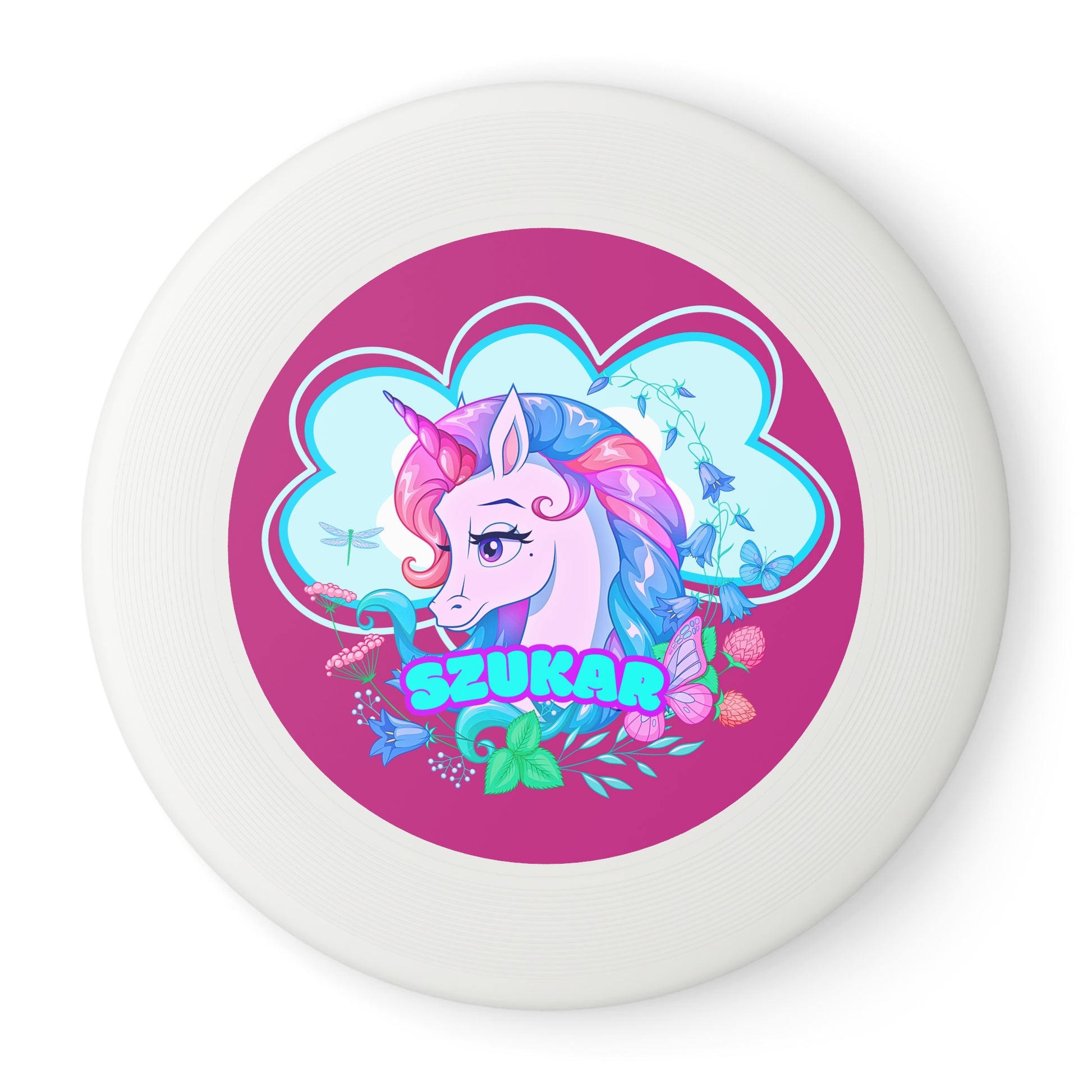 Durable black frisbee showcasing a circular motif and a whimsical pink unicorn illustration.