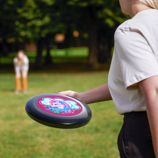 Black flying disc decorated with a prominent circle and a cute pink unicorn figure at its heart.