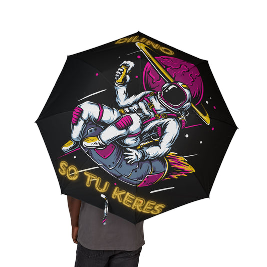 Umbrella featuring a bold astronaut graphic floating in space with the phrase “SO TU KERES” printed beneath.


