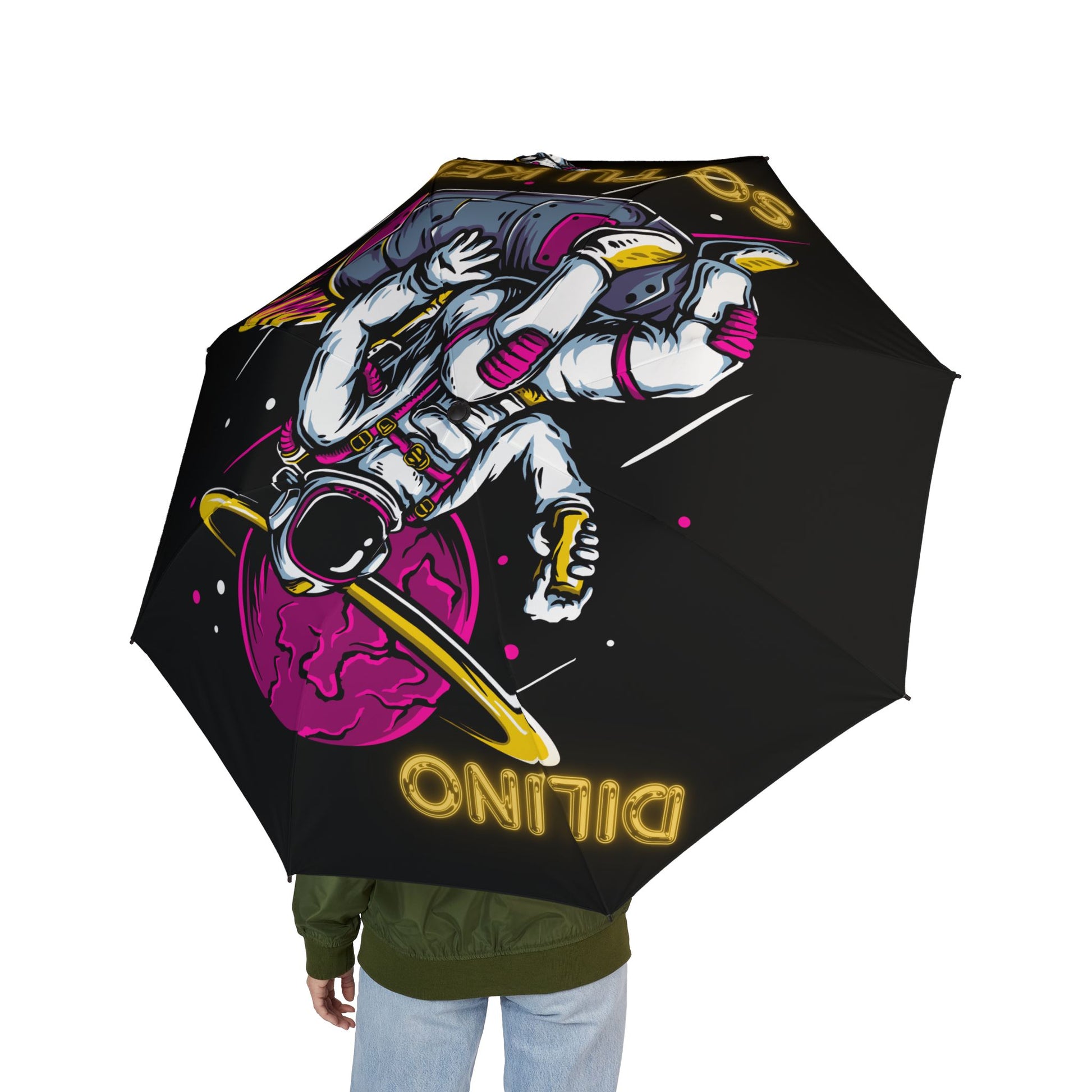 Unique umbrella showcasing an illustrated astronaut design with “SO TU KERES” text below, adding a cosmic vibe.

