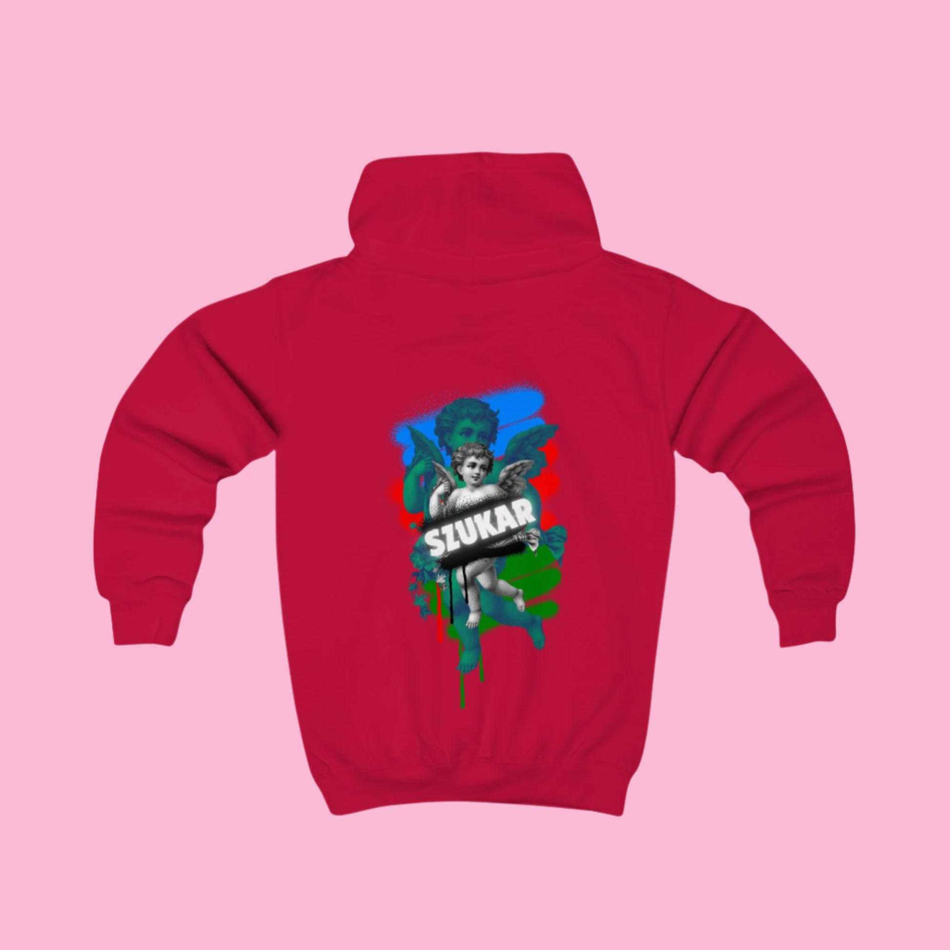 Red kids' hoodie with bold SZUKAR text and angel design over Roma-inspired background