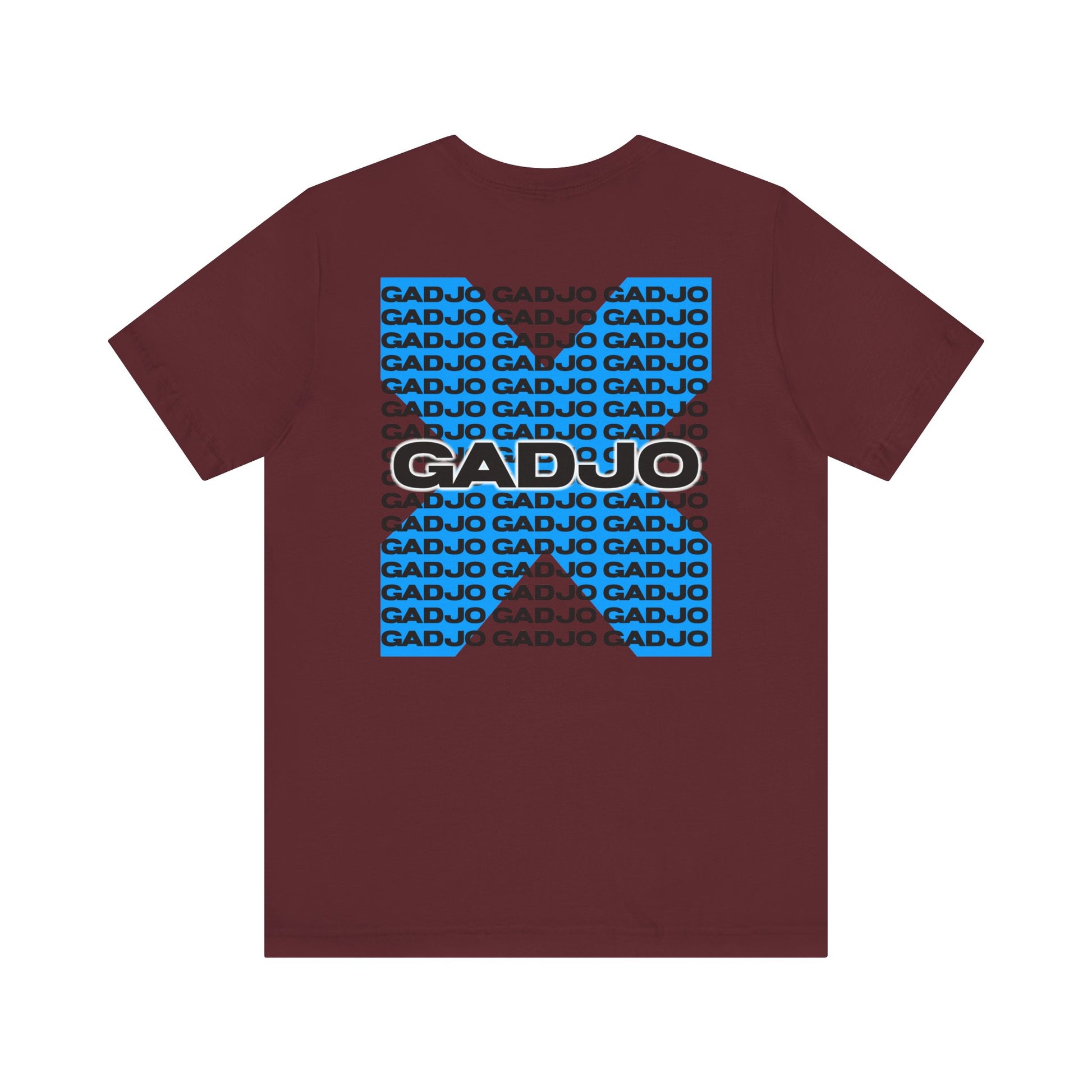 Minimalist t-shirt with small GADJO text printed over the heart, paired with a tiny crown icon.