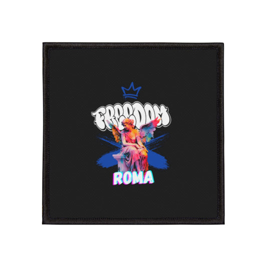 Detailed patch showing a winged angel, with “FREEDOM” text crowning the design and “ROMA” below.
