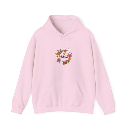 Elegant hoodie design where soft pink and white flowers circle around a gentle dove and gold-styled “ROMA” text.