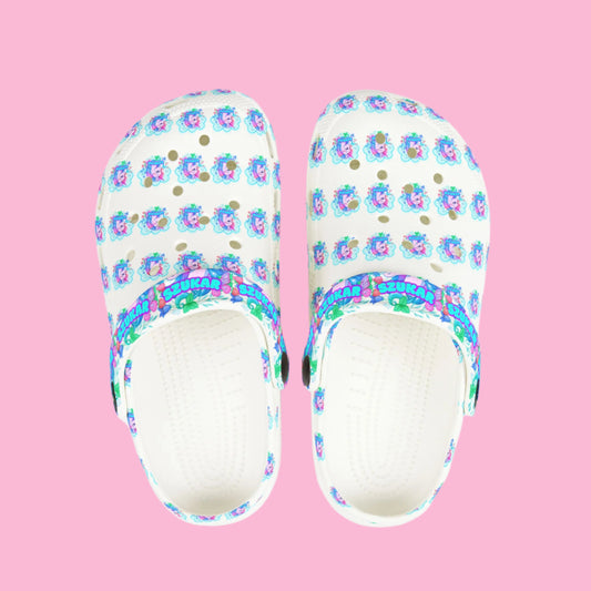 Kids’ Crocs decorated with magical unicorn images and pastel colors.

