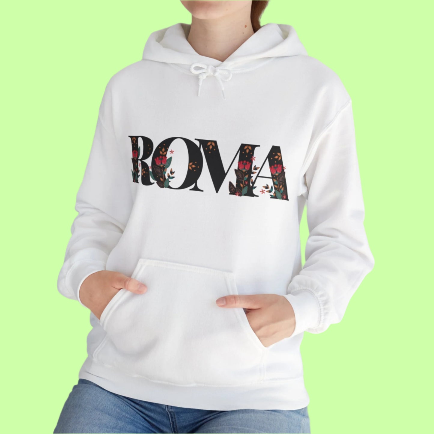 Floral-infused ROMA text design on hoodie, mixing streetwear and softness.

