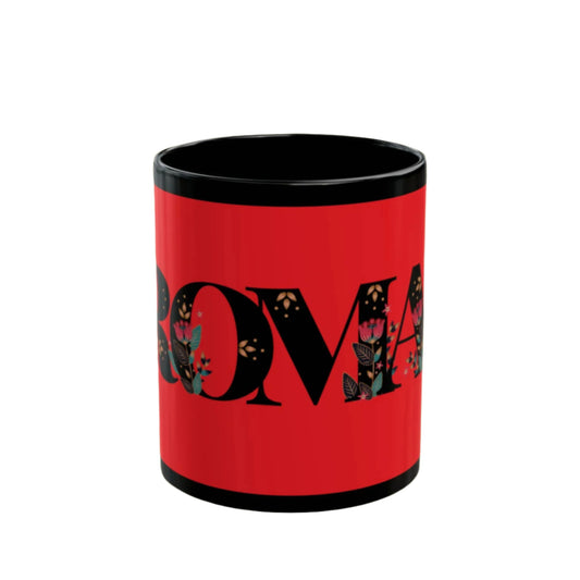 Coffee cup decorated with “ROMA” in artistic calligraphy across the front.

