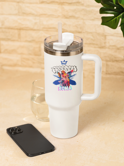 Stanley tumbler placed next to a smartphone