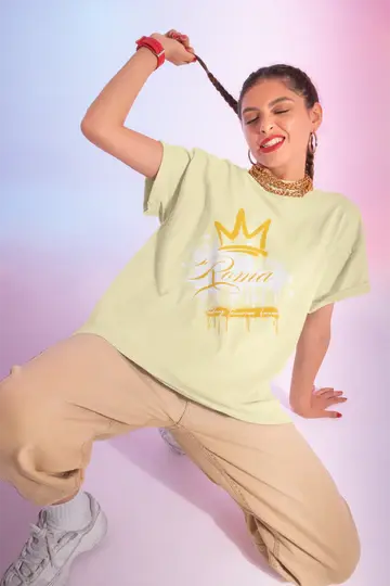 Person wearing a light green t-shirt with a graphic design on a gradient background