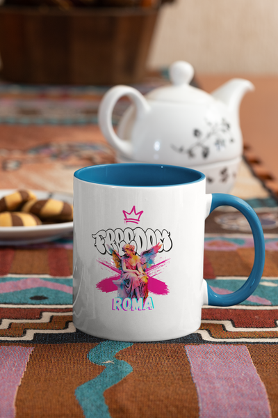Colorful mug placed beside biscuits and teapot