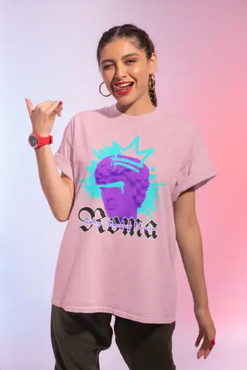 Person wearing a pink t-shirt with a colorful graphic design on a gradient background