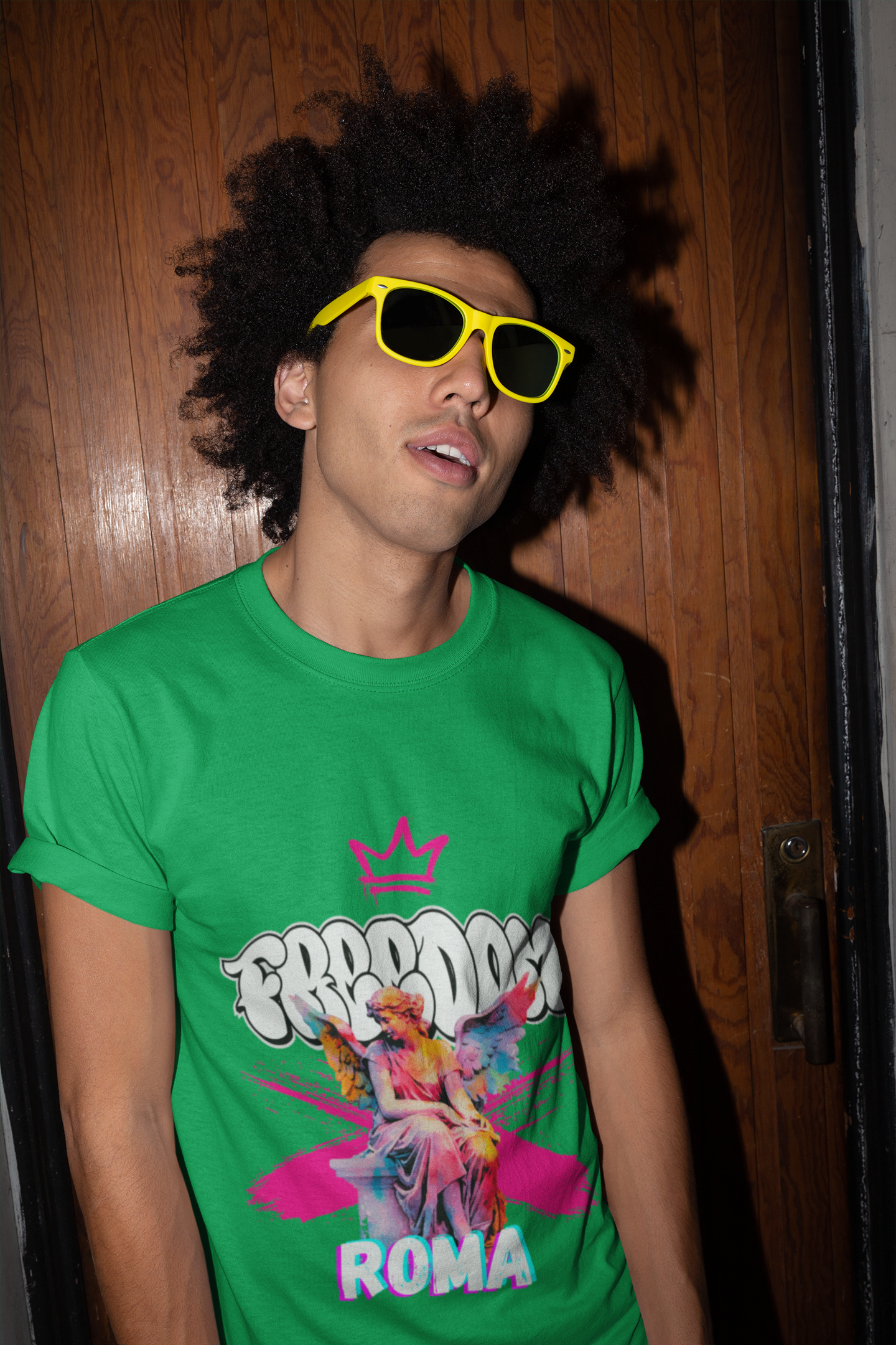 tshirt-mockup-of-a-man-with-sunglasses-against-a-wooden-door